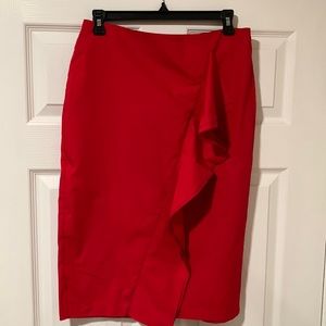 Red, knee length pencil skirt.